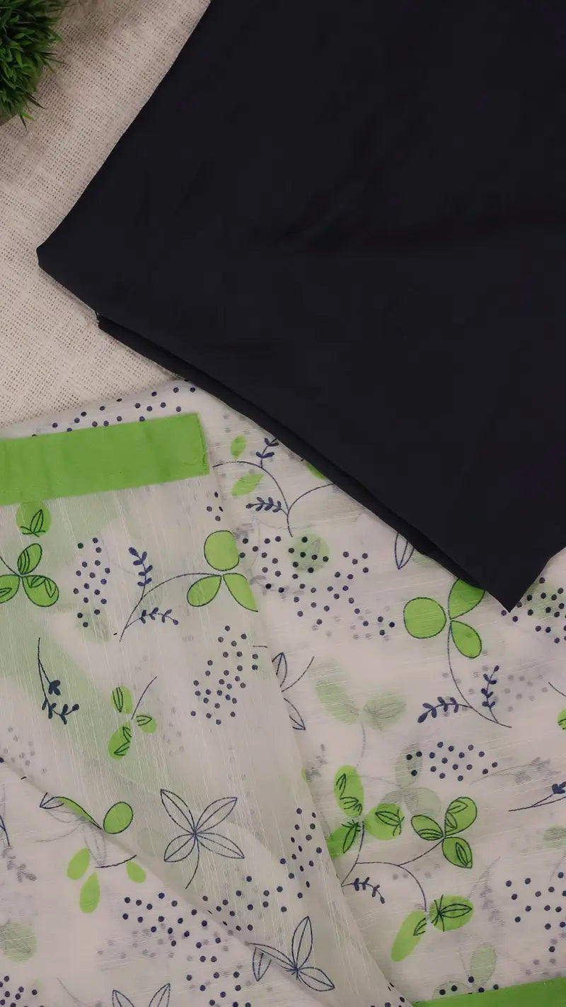 Black blouse fabric on a white linen saree with green floral patterns