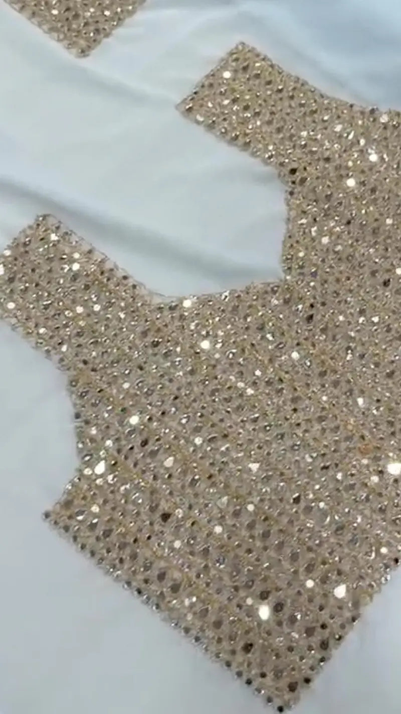 Close-up of the blouse of Sequin Georgette Saree With Heavy Mirror Work Border