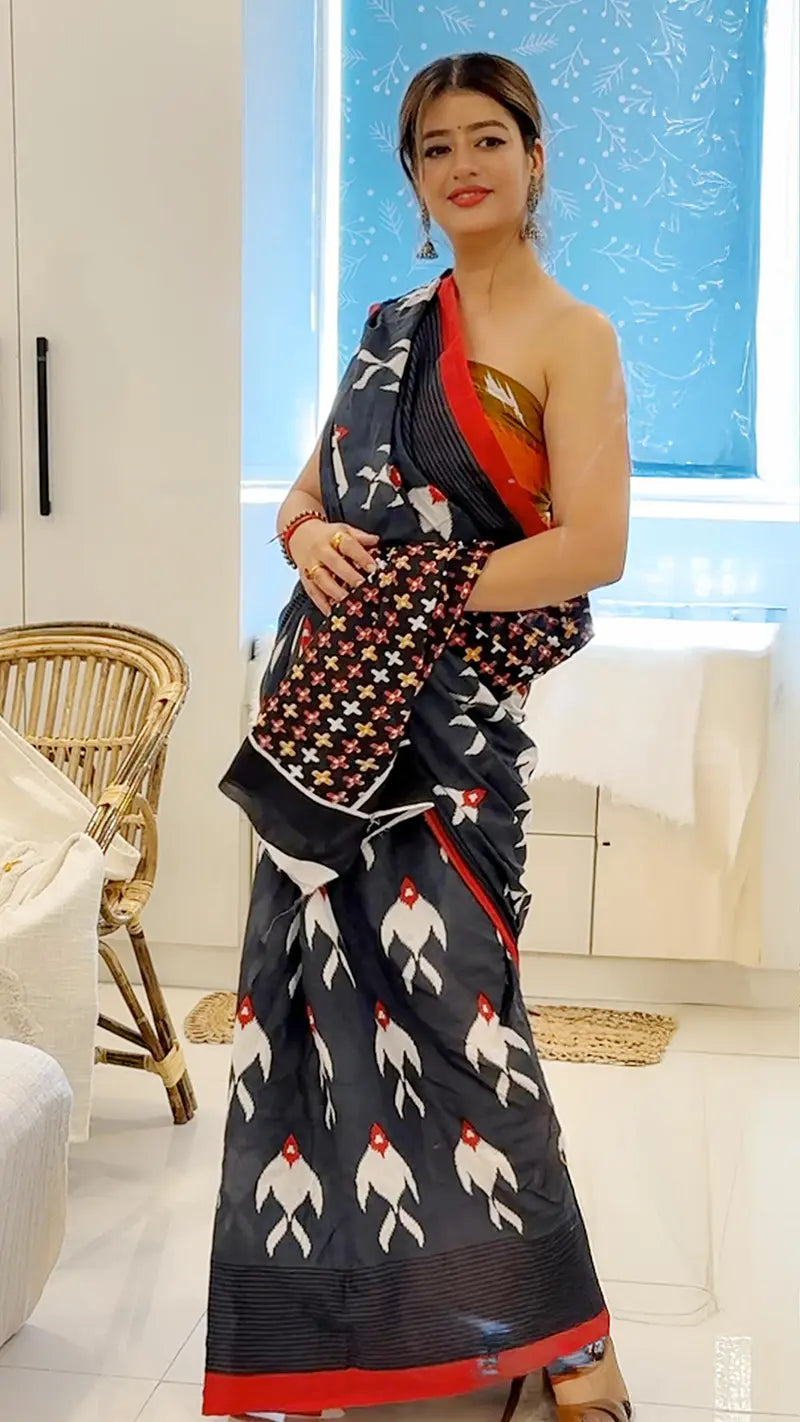 Woman wearing a traditional saree with a modern interior setting