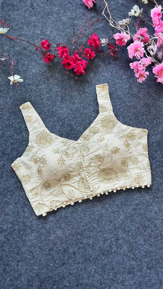 Cotton padded blouse with golden embroidered flowers on it