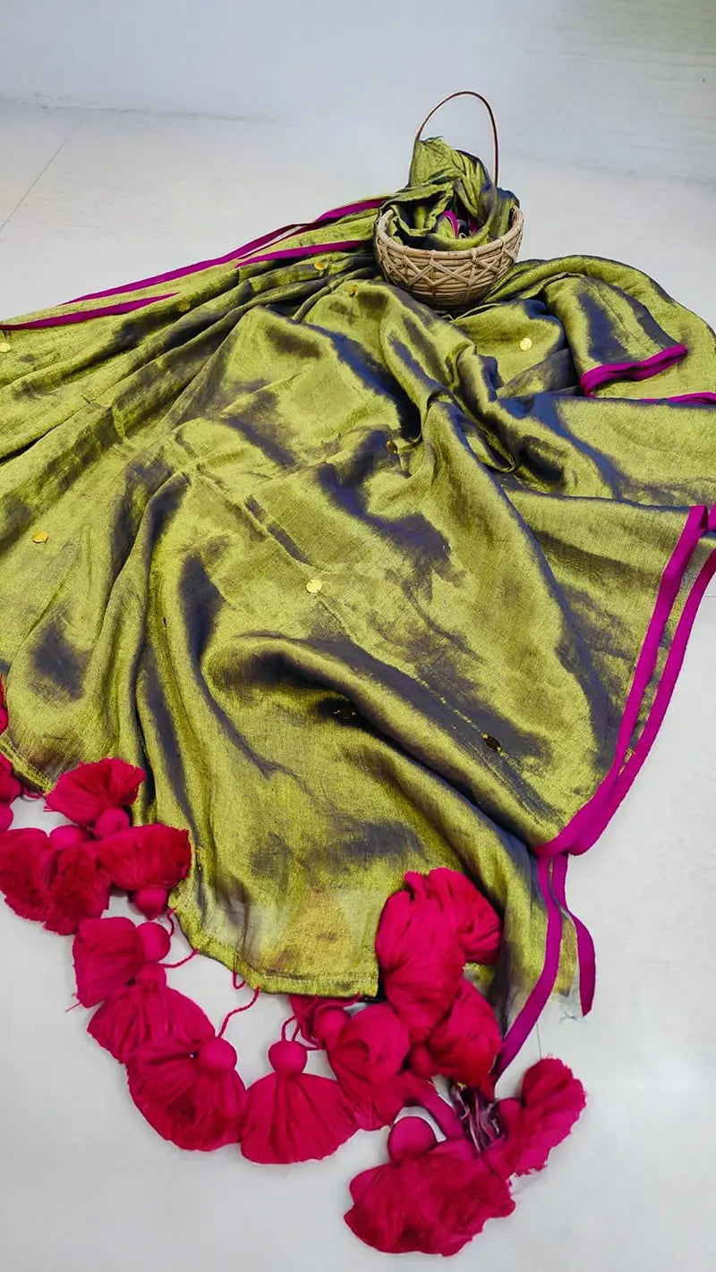 An olive green tissue saree with large tassels on a white background