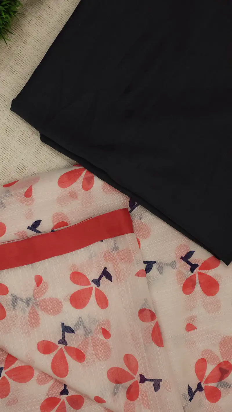 Black blouse fabric and floral-patterned linen saree on a textured surface