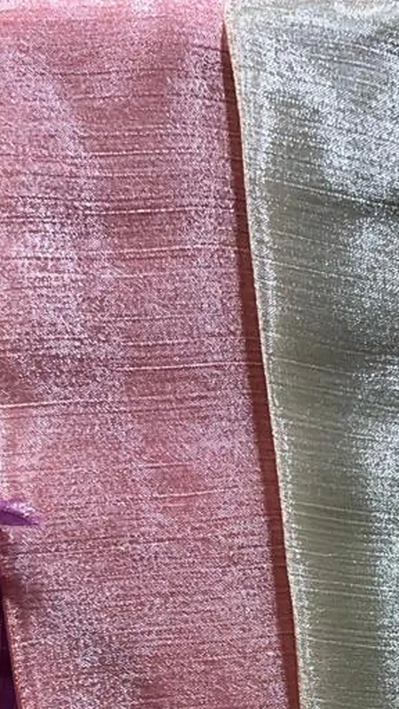 Close-up of pink textured saree fabric