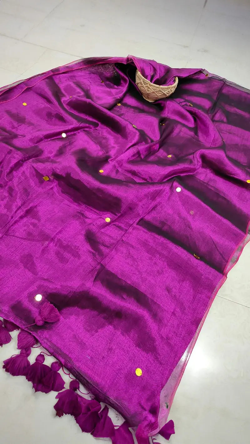 Purple tissue saree on a tiled floor